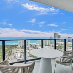 NEW: Stunning views 4 Bdrms Condo steps from the beach